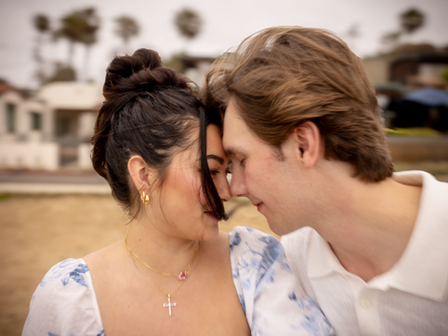 Tyler took his time and got out onto a rock very close to the waves.  You can see it was wet, but he went for it.  I could see the ring box in his right pocket.  He didn't wait long and took the knee!