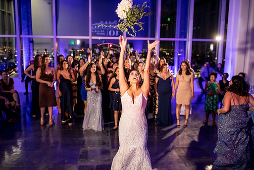 Fun-dance-floor-moment-bride-throws-bouquet