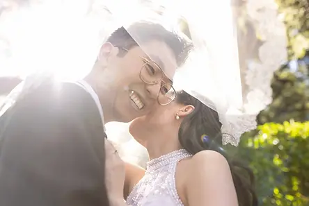 asian couple at the thursday club la canada under their veil laughing on their wedding day