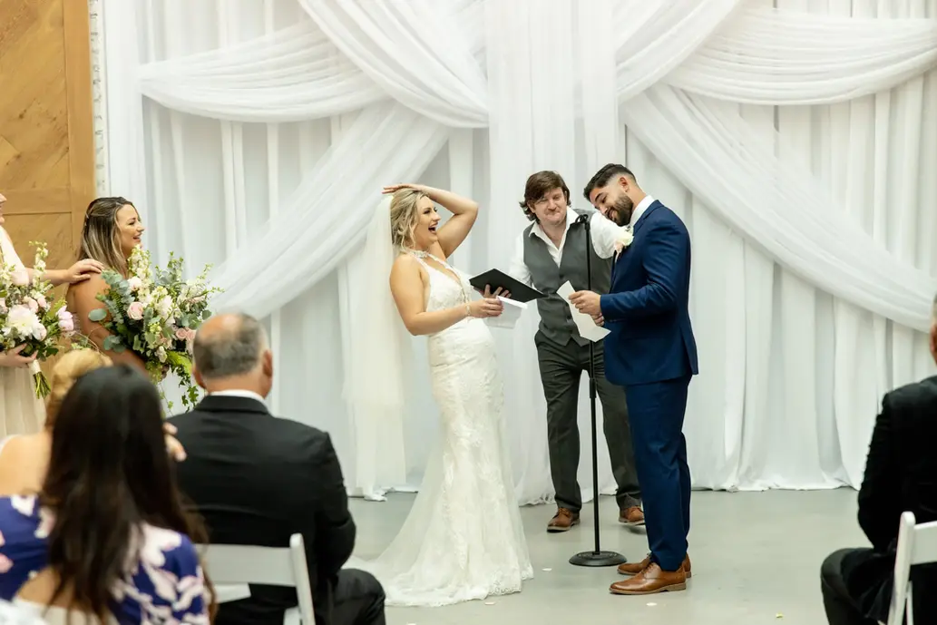 bride laughs during the ceremony