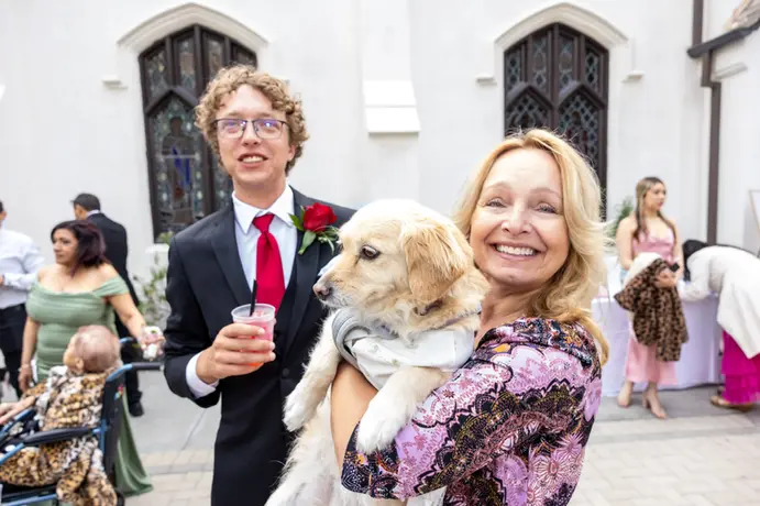 mom makes sure the photographer get s a photo of the dog