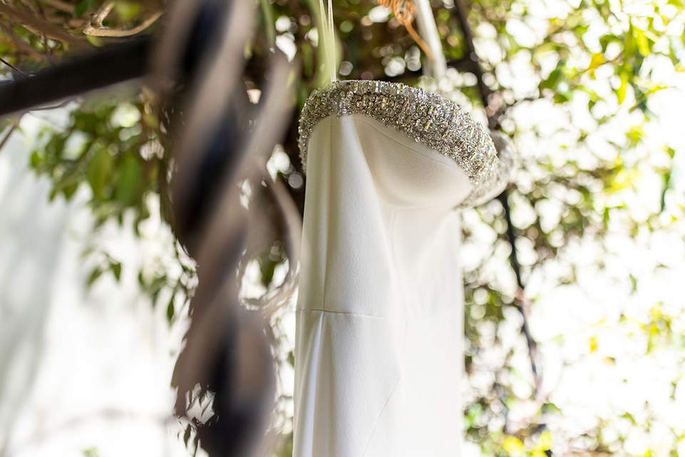 Gracie's white wedding dress with a beaded neckline
