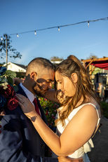 wedding in backyard as couple hugs in celebration