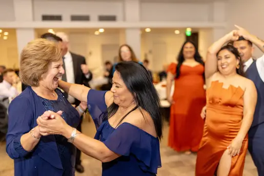 candid moment on the dance floor with the moms dancing