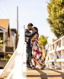 family portrait sessions couple kiss on a bridge