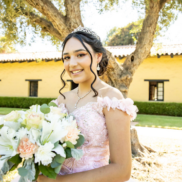 Quinceañera in Los Angeles with white floral bouquet