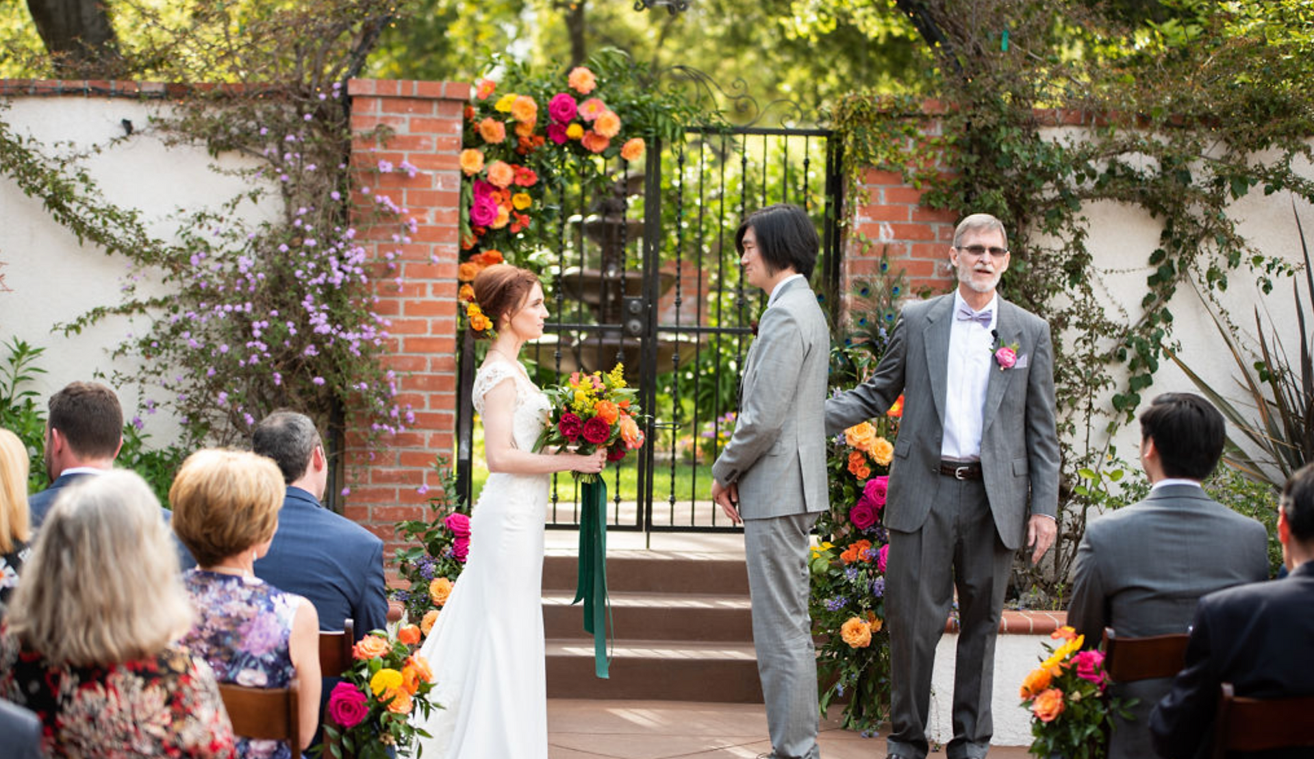 Wedding ceremony at The Thursday Club with floral arch