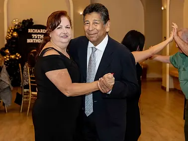 Guests dance together at a birthday celebration in Whittier.