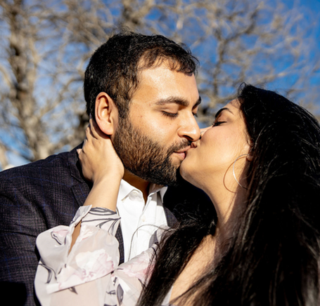Engaged couple kissing, outdoor engagement photo