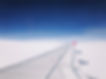 On A n Airplane Above The Clouds