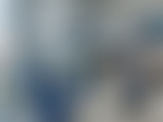 People wearing masks walk through an airport terminal. Scientists in blue coats work at a lab station. Planes visible through windows.