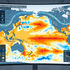 Curved monitor shows global atmospheric and oceanic weather analysis map with colorful SST anomalies, arrows, and ONI graph in a lab