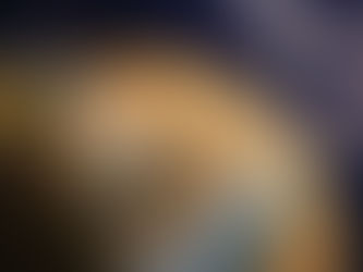 Spacecraft near Saturn's rings, glowing probe entering a planet's atmosphere. Brown and blue planet surface under starry sky.