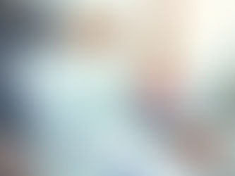 Real estate agent handing house keys to a buyer signing paperwork.