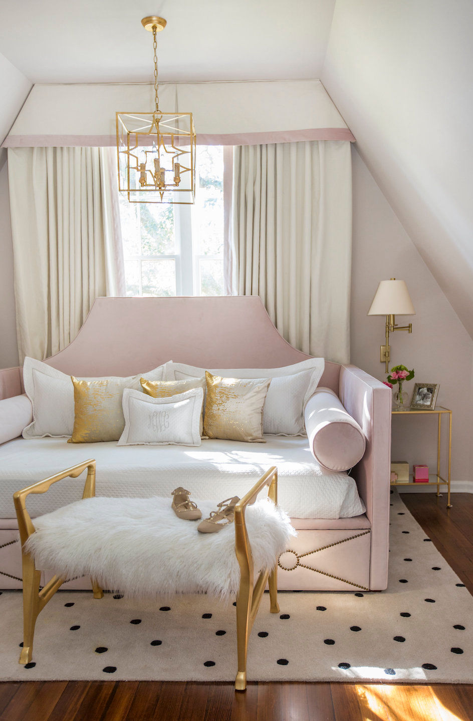 Elegant girl's room with pink and gold daybed
