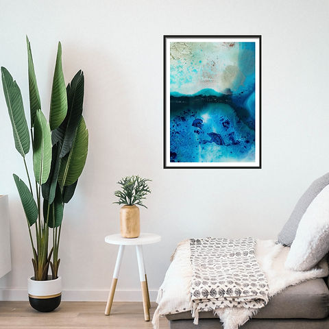 A minimalist interior with plants and a framed A3 print with abstract art