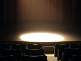 spotlight on empty theatre stage - empty seats