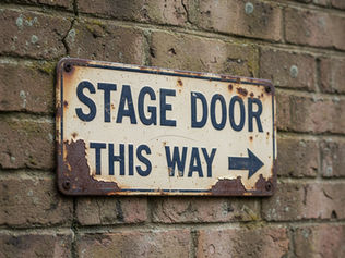 rusting metal sign STAGE DOOR THIS WAY