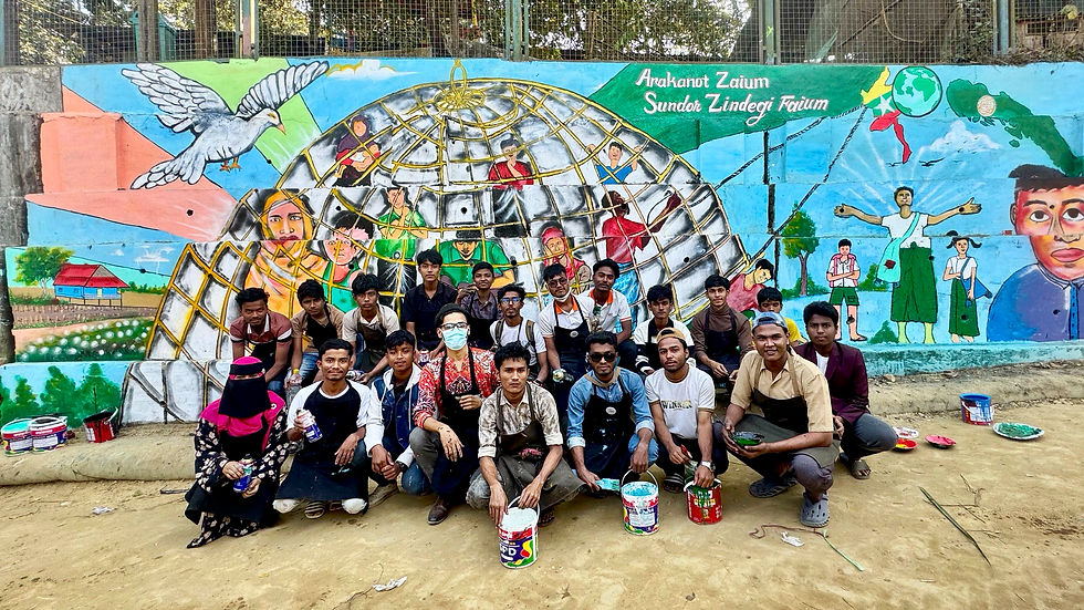 Members of the Rohingya Art Club and Rohingyatographer work together on a collective mural created during the 2026 Human Rights and Visual Storytelling Course. 2026 © Ayub Khan DKL.