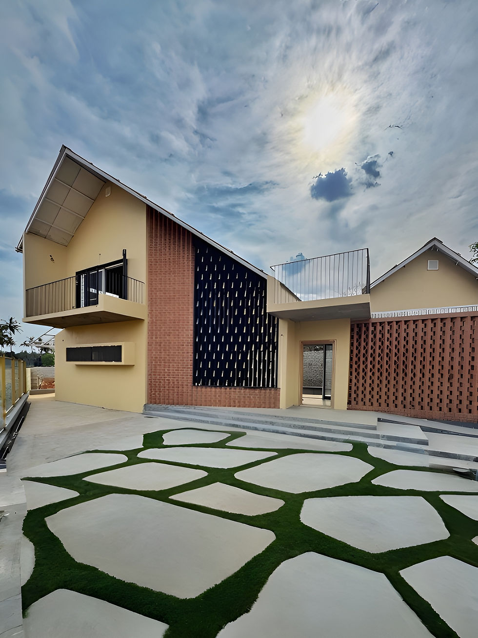 Modern house design with unique brickwork and landscaping