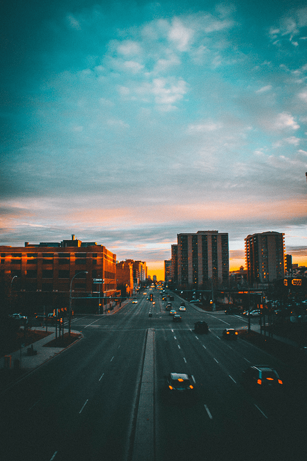 city sunset seen from road