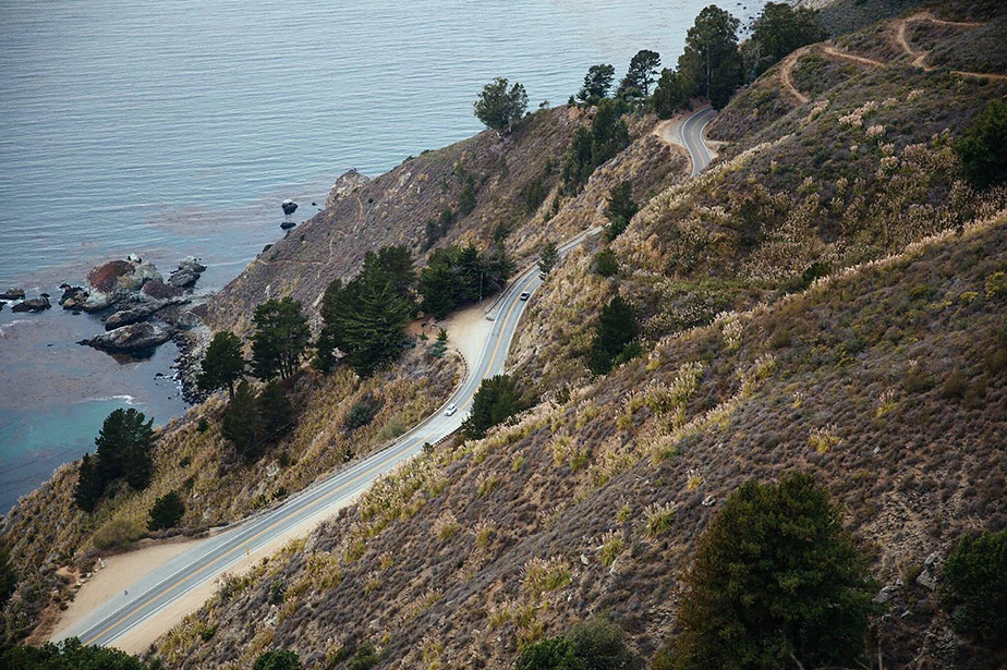 road on autumn mountain over sea