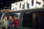 Guests posing in a photo booth at a TED Talk event