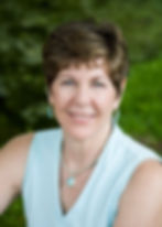 Woman photographed outdoors for a professional business headshot