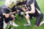 Home football team outdoors photographed during a lifestyle editorial session displaying product app in use