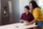 Woman and child photographed indoors during a lifestyle editorial portrait session for banking company