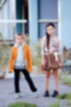 Child models showcasing boutique clothing during an outdoor commercial fashion photography session