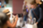 Vendor speaking with a TED Talk attendee during event photography coverage