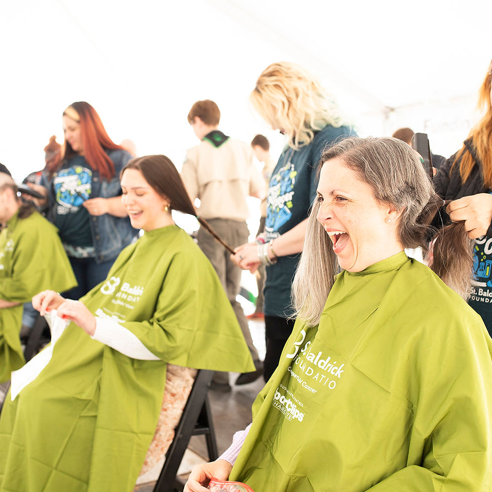 women shaving their heads for St. Baldrick's Foundation cancer research fundraiser.
