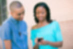 Couple testing a new mobile banking app during a lifestyle photography session for banking institution
