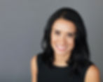Professional studio headshot of woman with dark hair