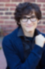 Professional modeling portrait of teen male in a dark blue shirt