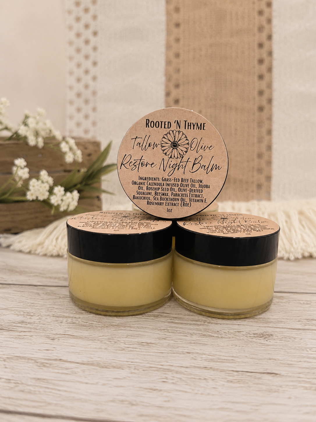 Restore Night Balm jars with wooden lids on a table