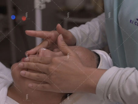 Hands gently cleansing face for early aging skincare with RJ Clinic skincare product