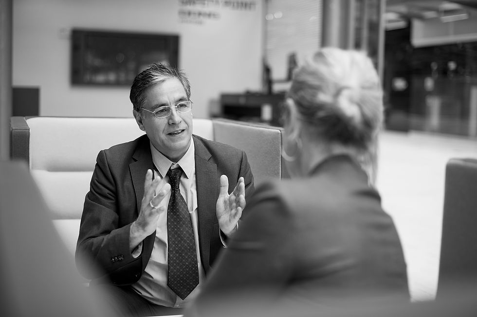 Two business professionals in discussion representing strategic advisory consulting