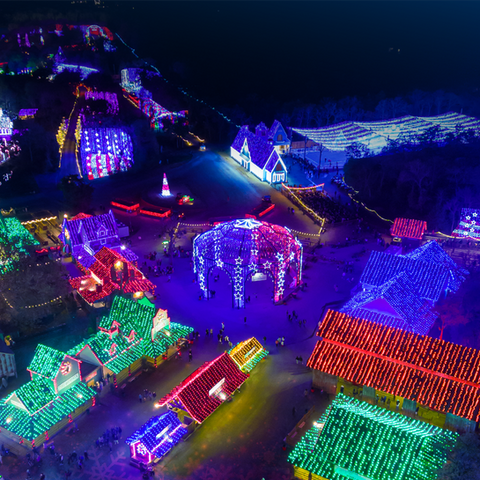 Aerial view of outdoor holiday light village with season pass