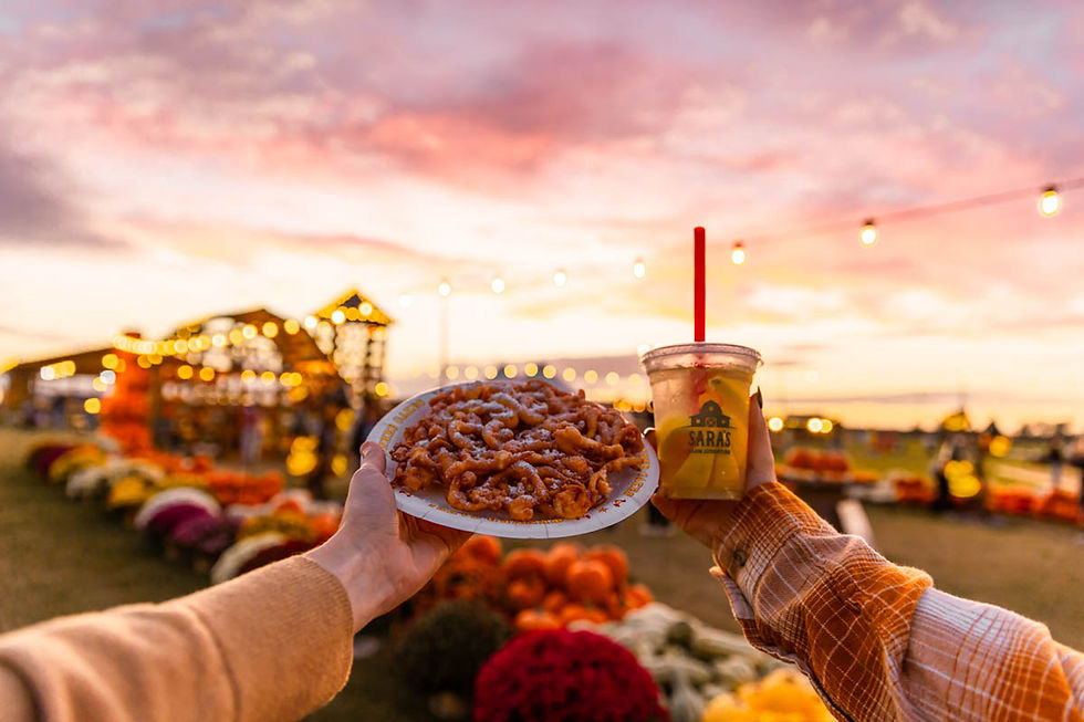 Funnel cake and lemonade at a fall festival sunset.