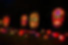 Illuminated sugar skull pumpkins at night