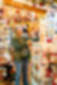 Woman Christmas shopping in a festive holiday gift shop.