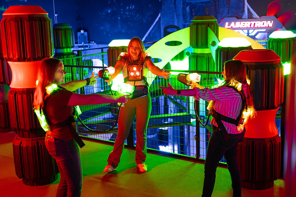 three women laser gun stand off