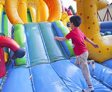 Child running on an inflatable
