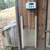 Automatic small aluminium coop door for sale on the Poultry Australia website.