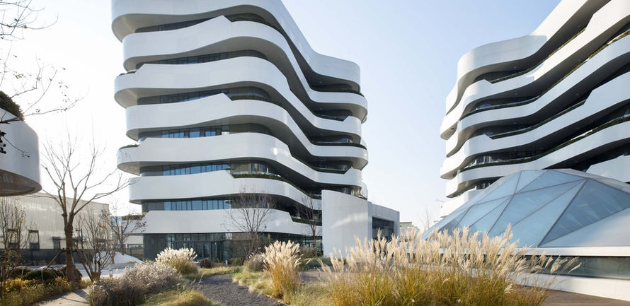 Timber boardwalk between wave-form office towers at Tianyun landscape, Beijing