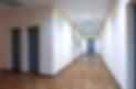 empty long corridor in the modern office building.jpg