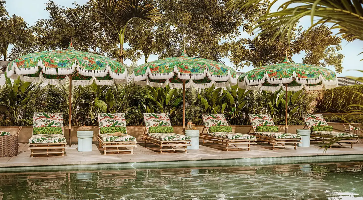 clarke and clarke emma shipley wild escapes indoor outdoor fabrics ss26 on parasols beside a pool