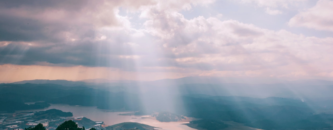 sun beams through the morning clouds
